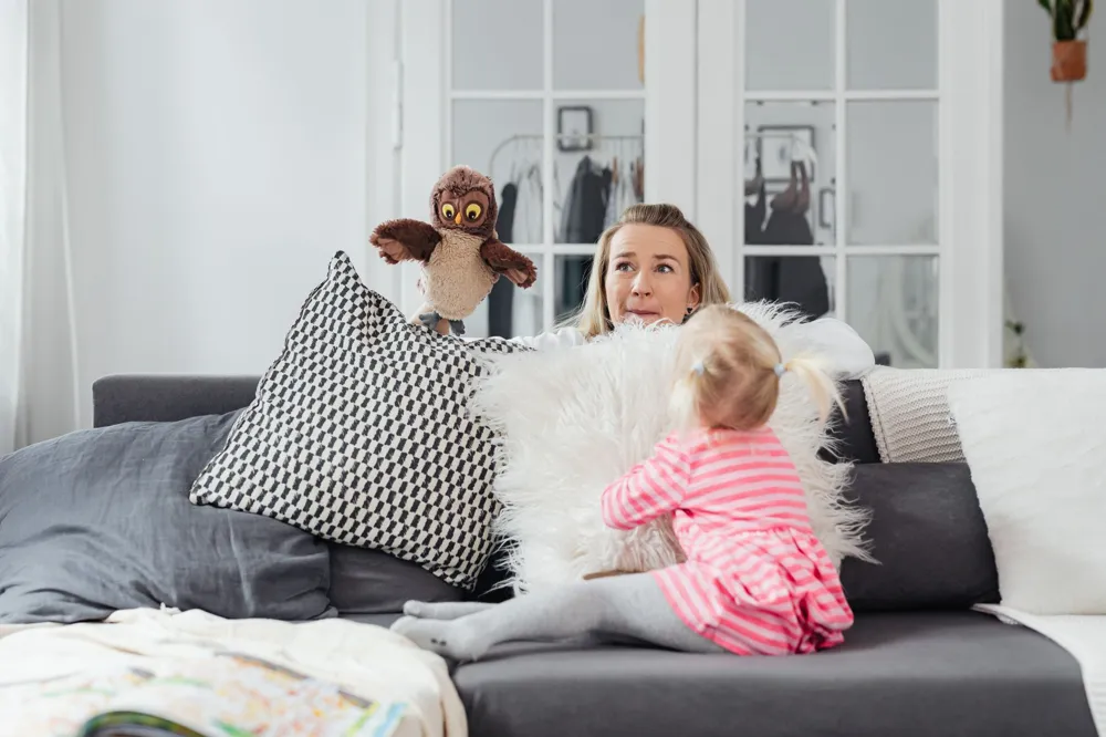 Therapist and child using puppets in a CBPT session