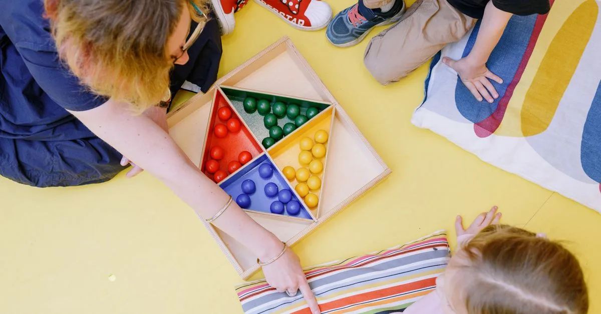 Clinician guiding a child in directive play therapy