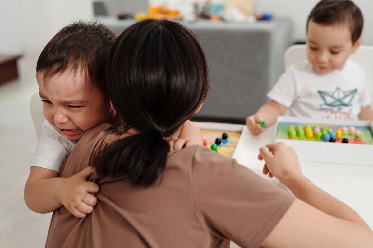 Child showing distress at separation from a parent