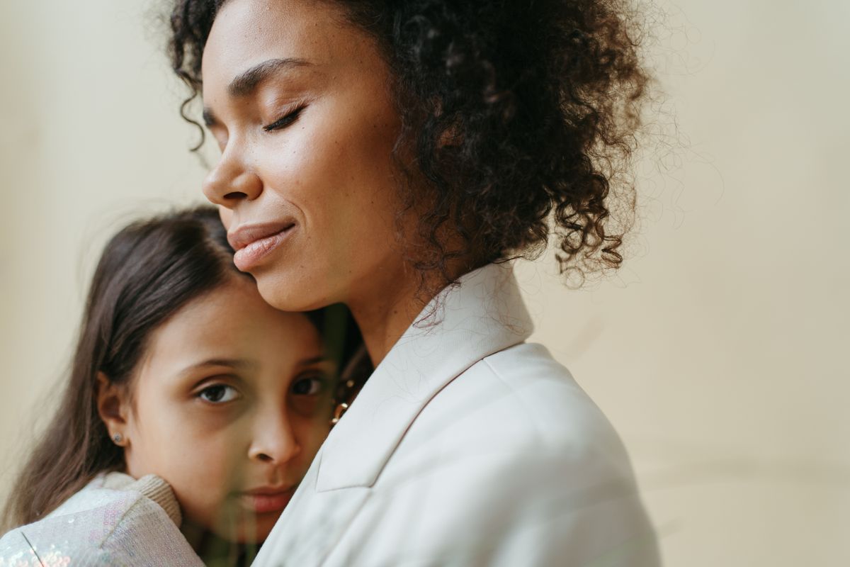 Parent offering calm reassurance, part of CBPT parent work for separation anxiety