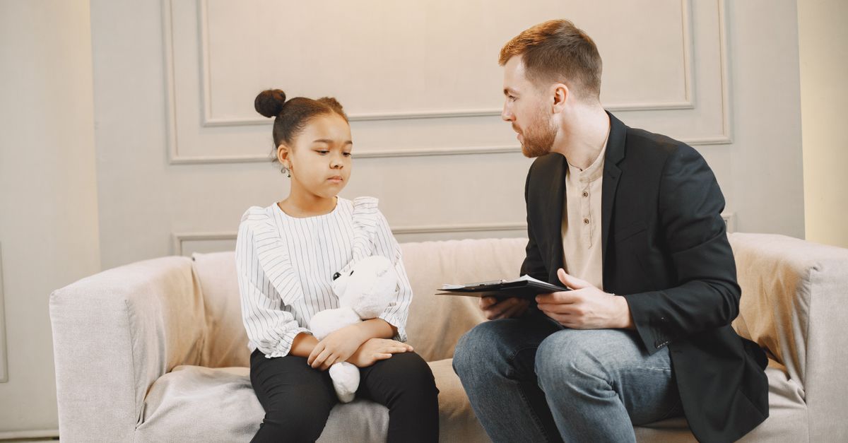 Child working with the therapist in a CBPT session for specific phobia