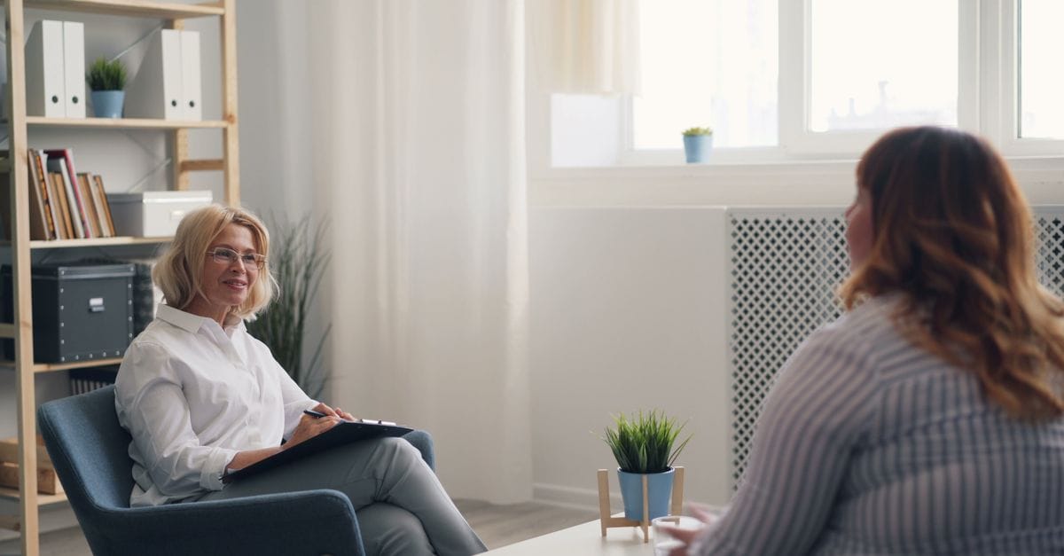 Therapist working with a child in a Cognitive Behavioral Play Therapy session